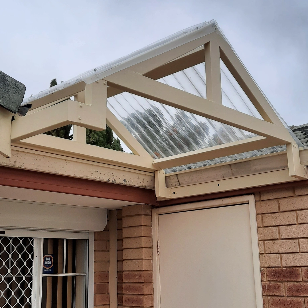 Contractor inspecting roof eaves